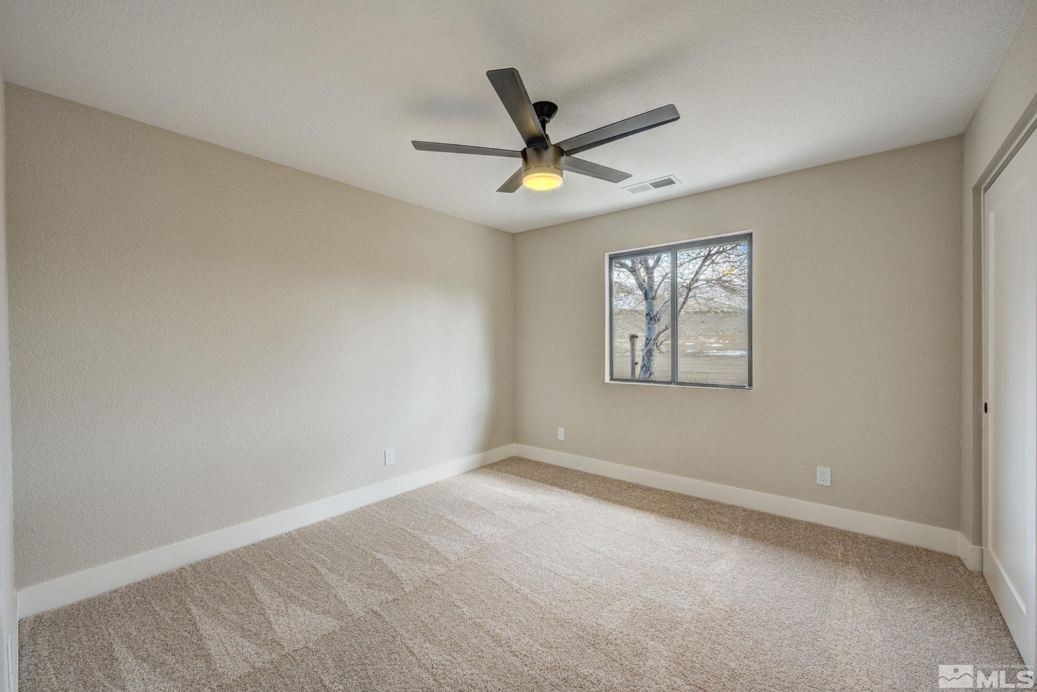 2900 Right Hand Canyon Road Reno, NV 89510 - Photo 24 of 29 an empty room with windows and fan