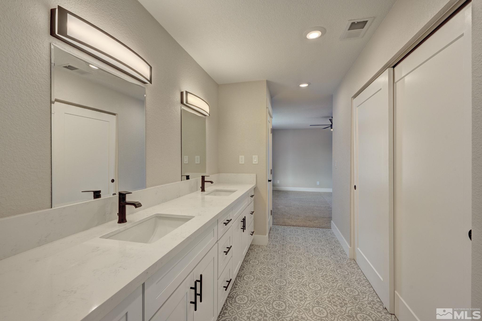 2900 Right Hand Canyon Road Reno, NV 89510 - Photo 29 of 29 a bathroom with a double vanity sink and mirror