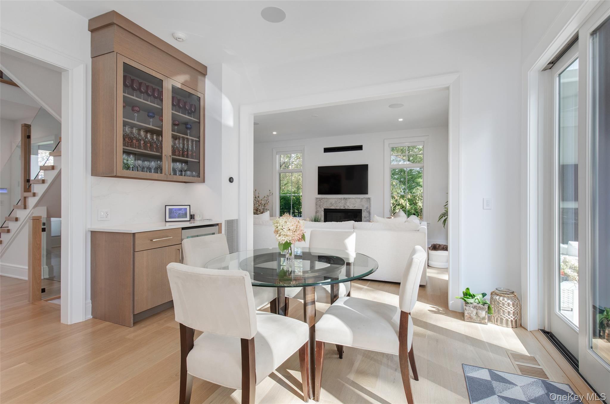 16 Myrtledale Road Scarsdale, NY 10583 - Photo 11 of 48 Another view of the breakfast room with built in cabinetry and beverage refrigerator and open to the family room