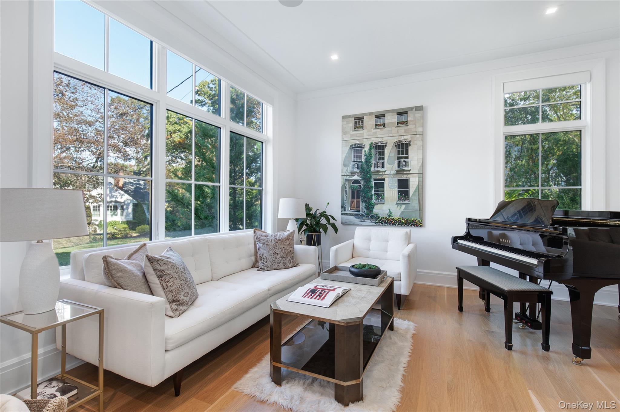 16 Myrtledale Road Scarsdale, NY 10583 - Photo 14 of 48 Another view of the formal living room showcasing the large picture window and additional windows bringing generous natural light into the space