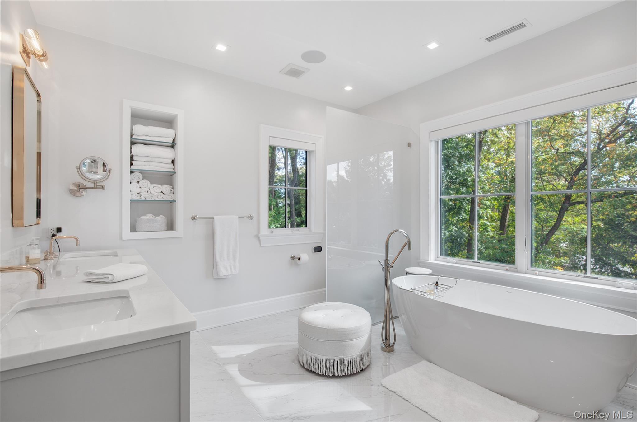 16 Myrtledale Road Scarsdale, NY 10583 - Photo 26 of 48 Luxurious primary bathroom with a large floating soaking tub, double vanities, glass enclosed large shower and spa toilet