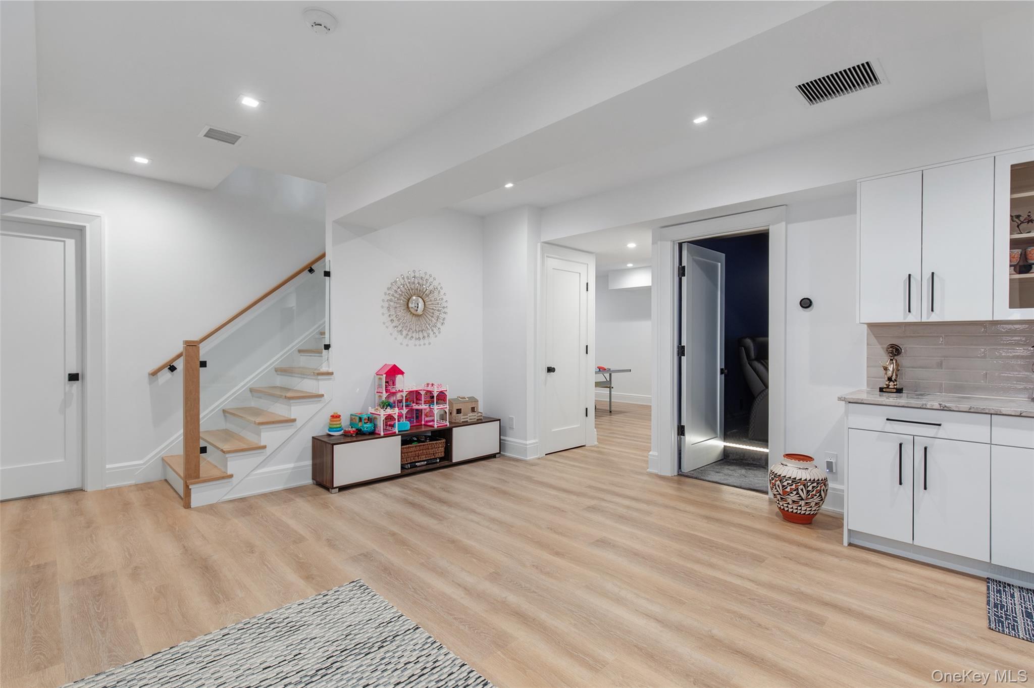 16 Myrtledale Road Scarsdale, NY 10583 - Photo 35 of 48 Beautiful lower level playroom accessed via modern staircase