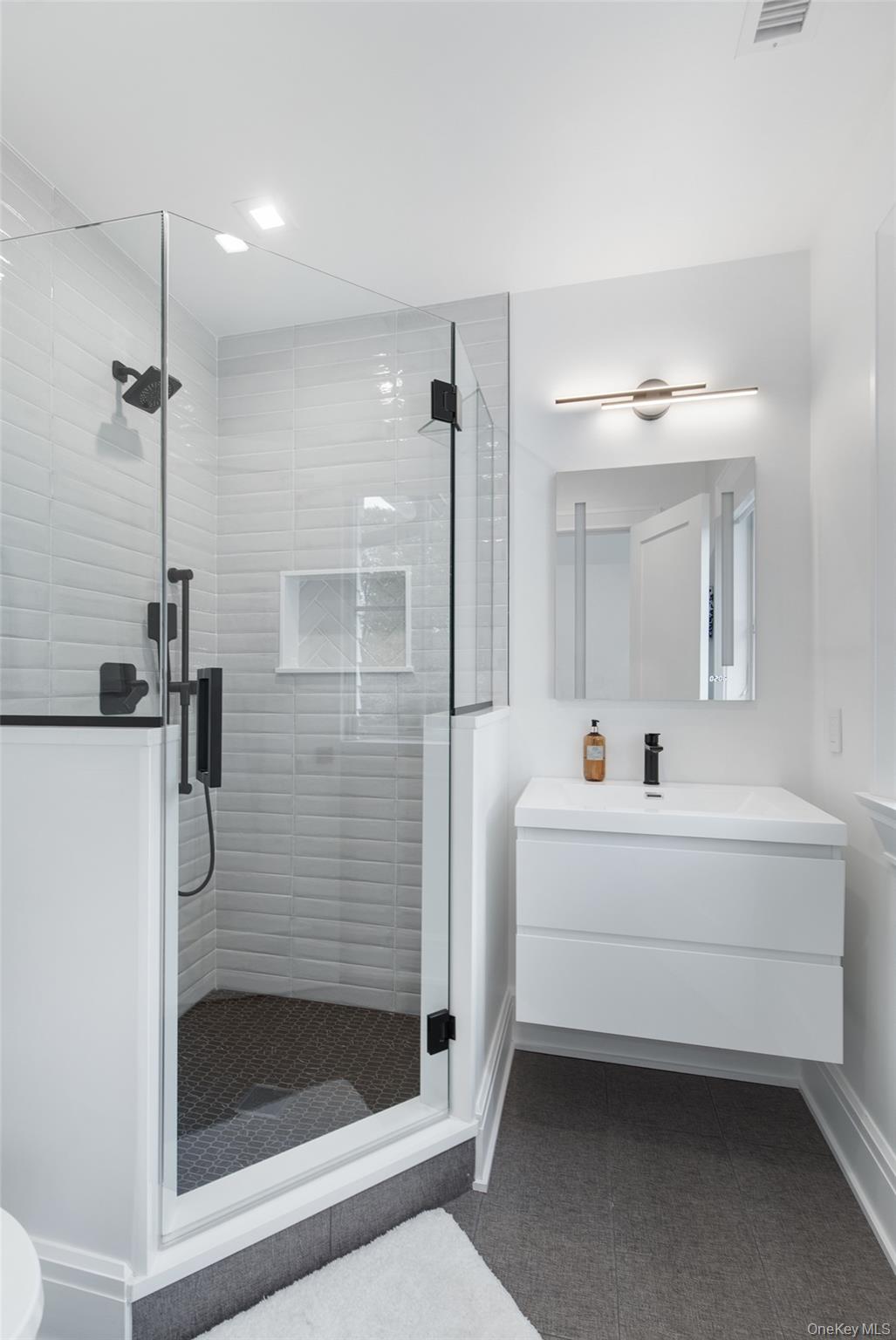 16 Myrtledale Road Scarsdale, NY 10583 - Photo 37 of 48 Bathroom featuring vanity and a stall shower