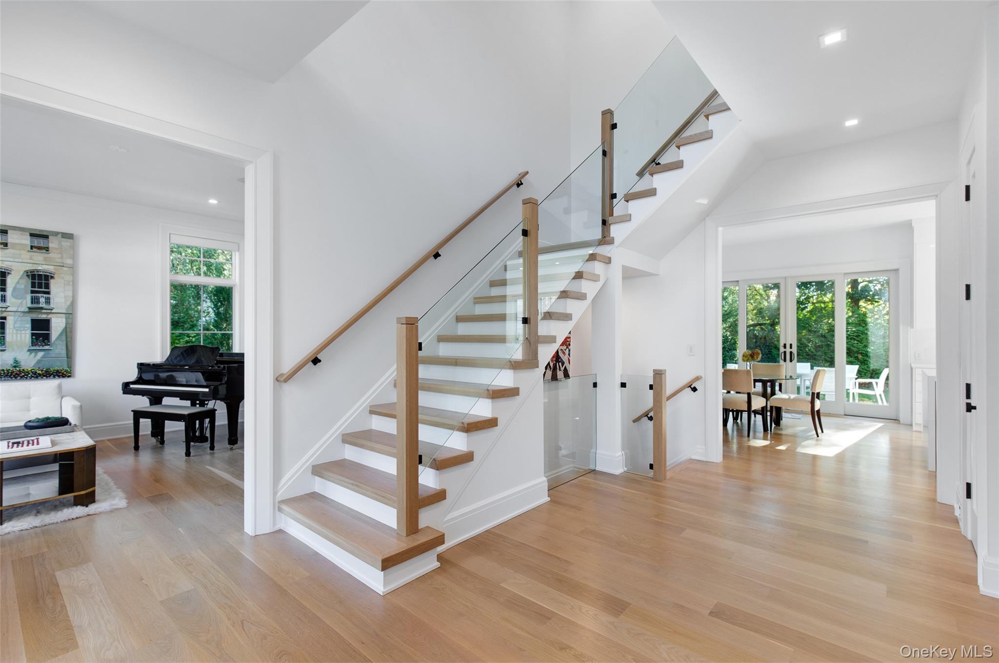 16 Myrtledale Road Scarsdale, NY 10583 - Photo 4 of 48 View of two story entry with striking modern staircase with glass railing