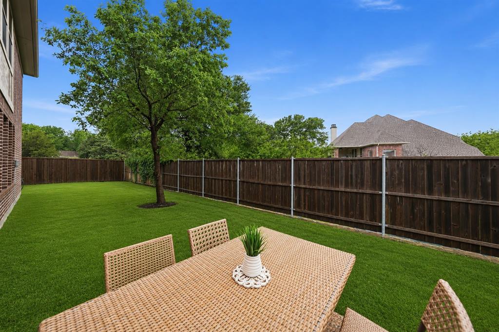 624 Sorrell Road McKinney, TX 75072 - Photo 26 of 28 a view of a deck with a table and chairs