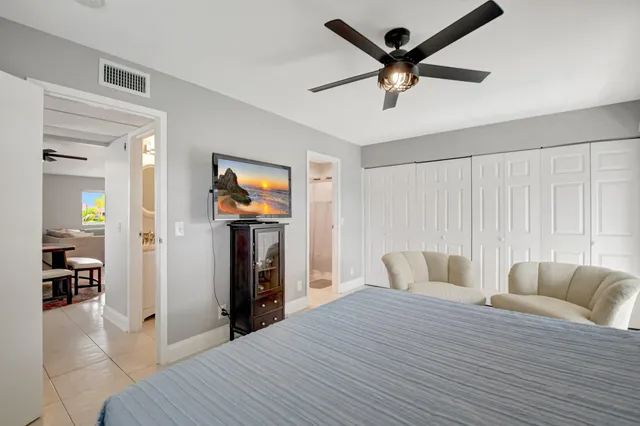a bedroom with furniture and natural light
