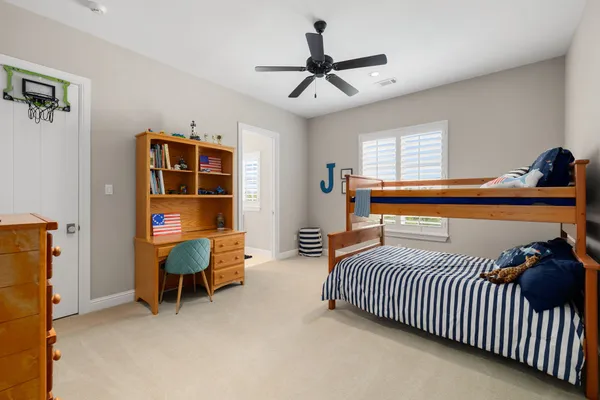 a bedroom with furniture and a window