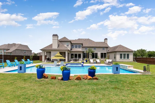 a front view of house with yard and outdoor seating