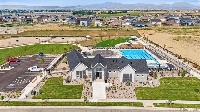 swimming pool view with a lake view