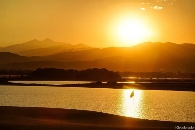 a view of an ocean and a mountain