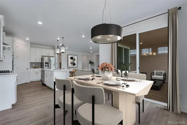 a very nice looking dining room with a table and chairs