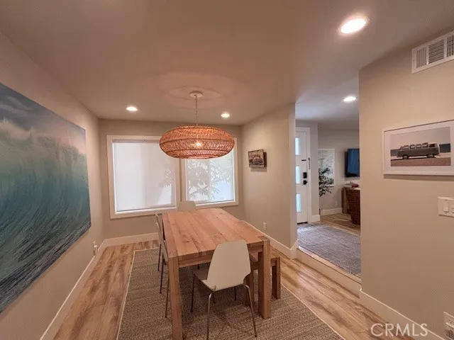 a view of a kitchen with dining table and chairs