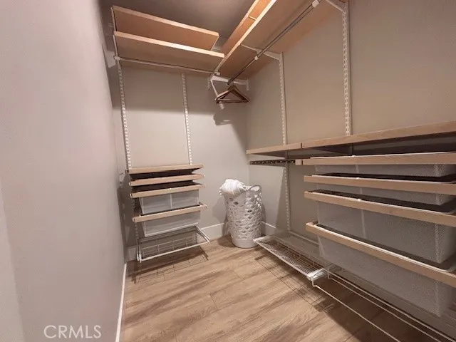 a bedroom with a bed and a lamp