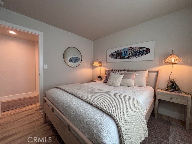 2920 Camino Capistrano, Unit 9D San Clemente, CA 92672 - Photo 29 of 54 a bedroom with a bed and a lamp