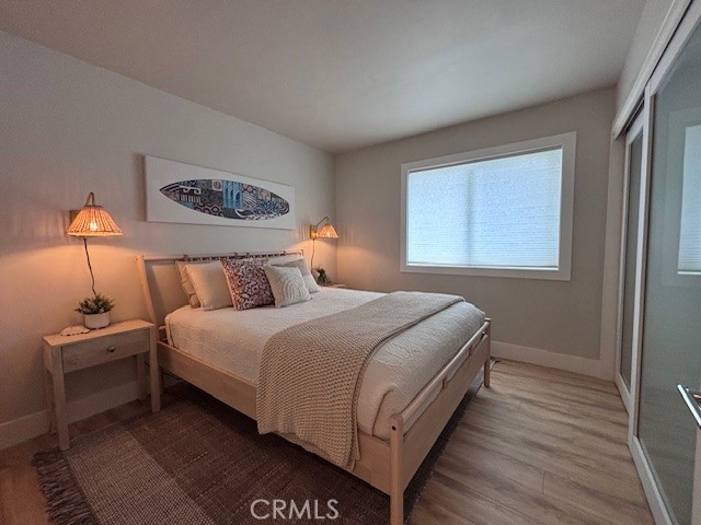 2920 Camino Capistrano, Unit 9D San Clemente, CA 92672 - Photo 30 of 54 a bedroom with a bed and a lamp on dresser
