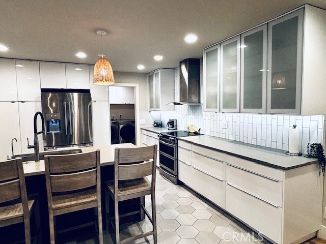 2920 Camino Capistrano, Unit 9D San Clemente, CA 92672 - Photo 3 of 54 a kitchen with a refrigerator and a stove top oven