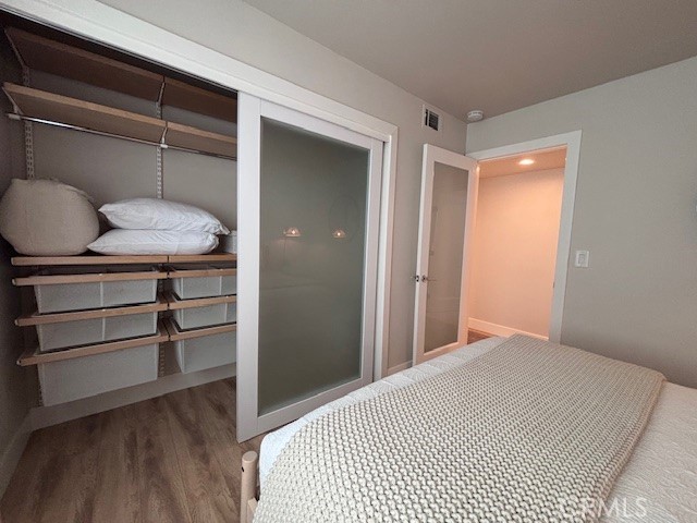 2920 Camino Capistrano, Unit 9D San Clemente, CA 92672 - Photo 32 of 54 a bedroom with a bed and cabinets