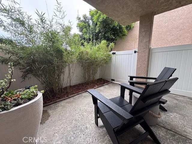 a backyard of a house with outdoor seating