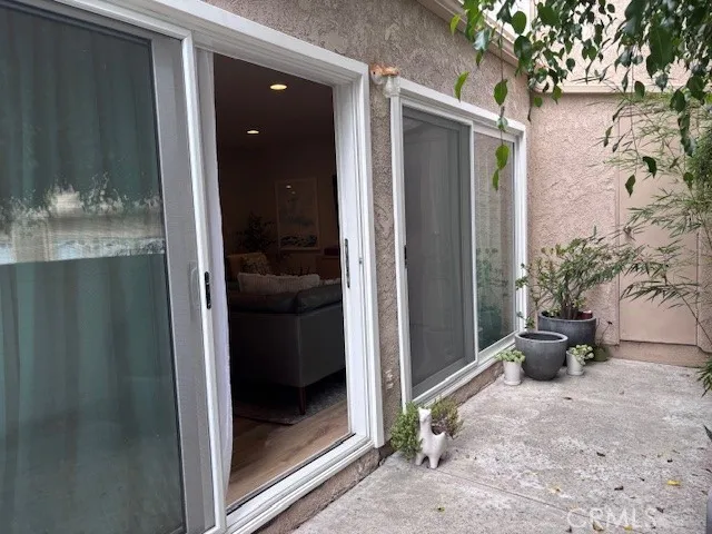 a view of a livingroom with a potted plant