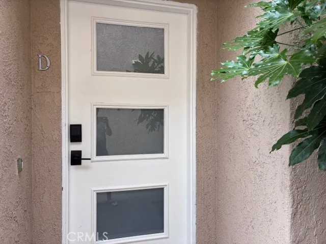 a view of a hallway with stairs
