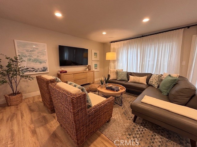 2920 Camino Capistrano, Unit 9D San Clemente, CA 92672 - Photo 6 of 54 a living room with furniture wooden floor and a flat screen tv