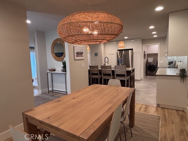2920 Camino Capistrano, Unit 9D San Clemente, CA 92672 - Photo 10 of 54 a kitchen with stainless steel appliances a dining table chairs and stove