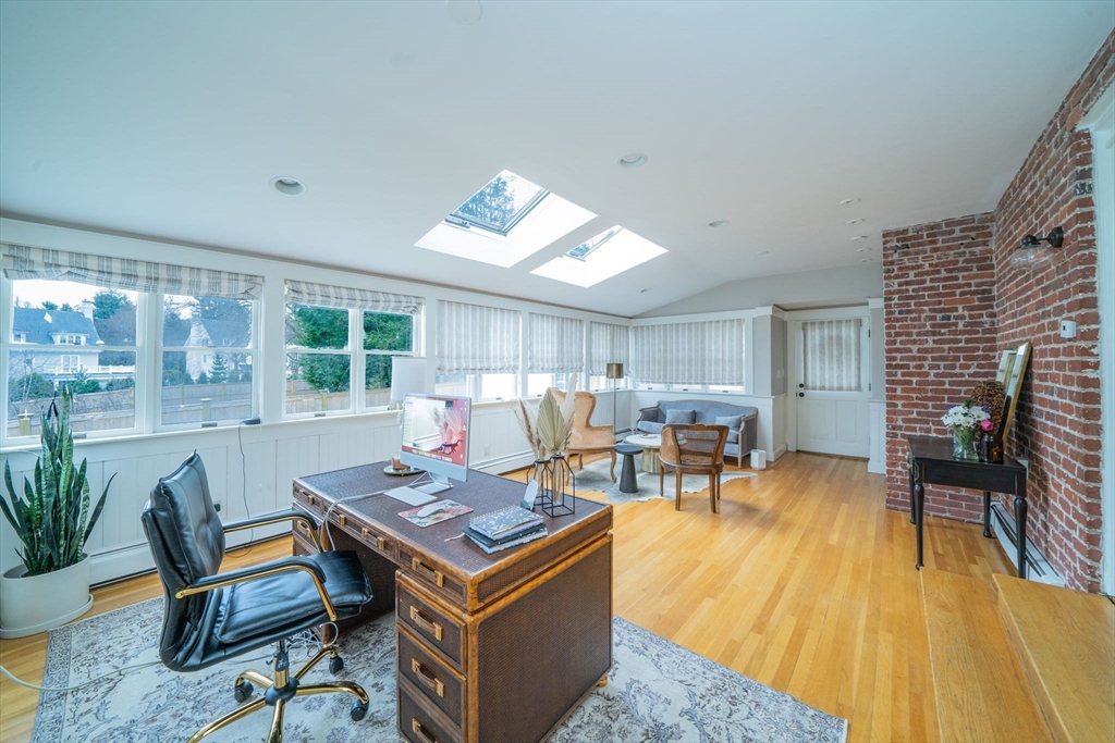 642 Centre Street Newton, MA 02458 - Photo 15 of 37 a living room with furniture and a fireplace