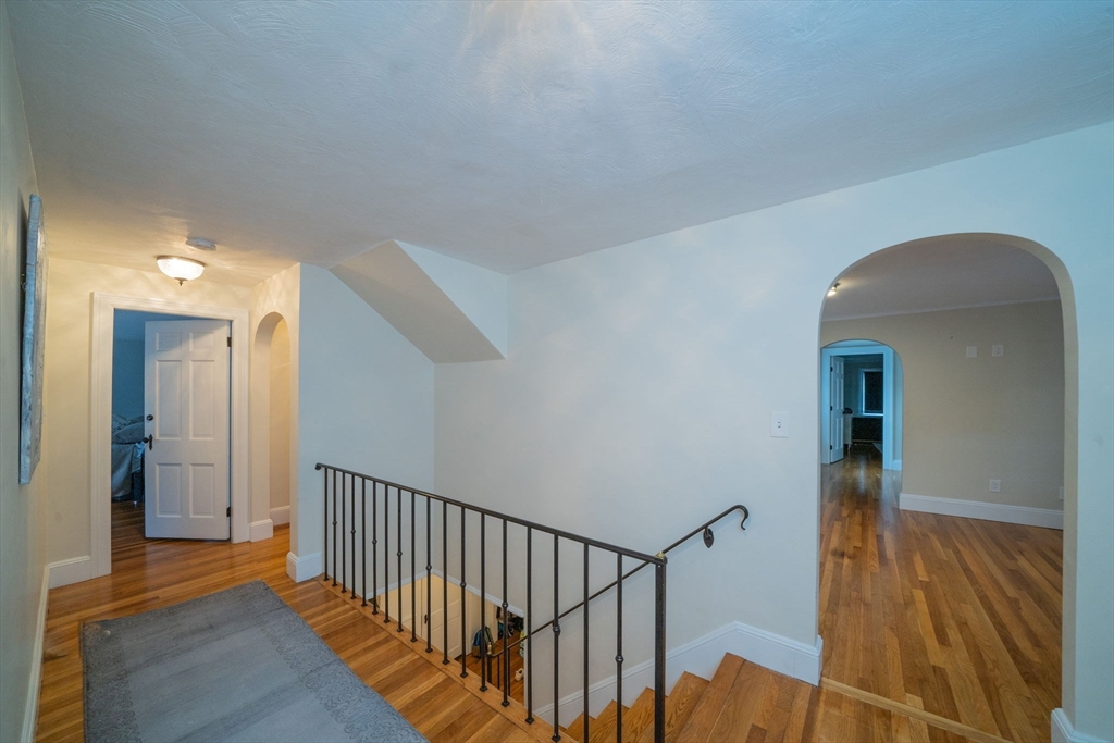 642 Centre Street Newton, MA 02458 - Photo 17 of 37 a view of a hallway with wooden floor and entryway