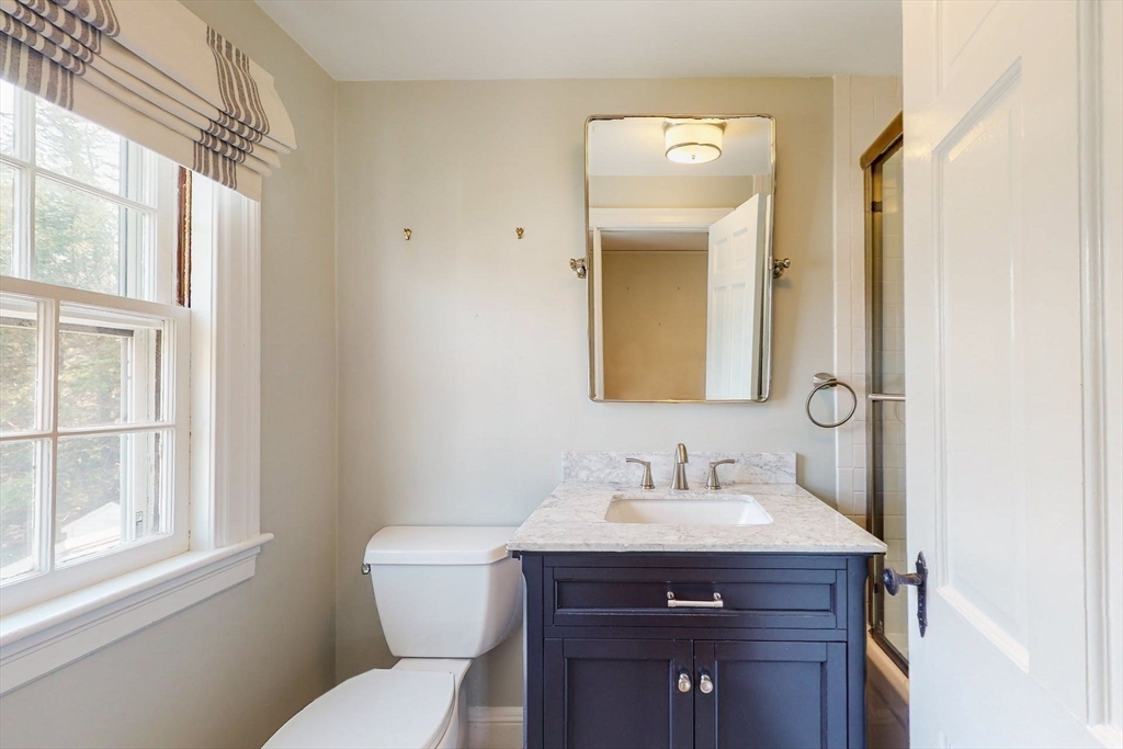 642 Centre Street Newton, MA 02458 - Photo 20 of 37 a bathroom with a sink and a toilet