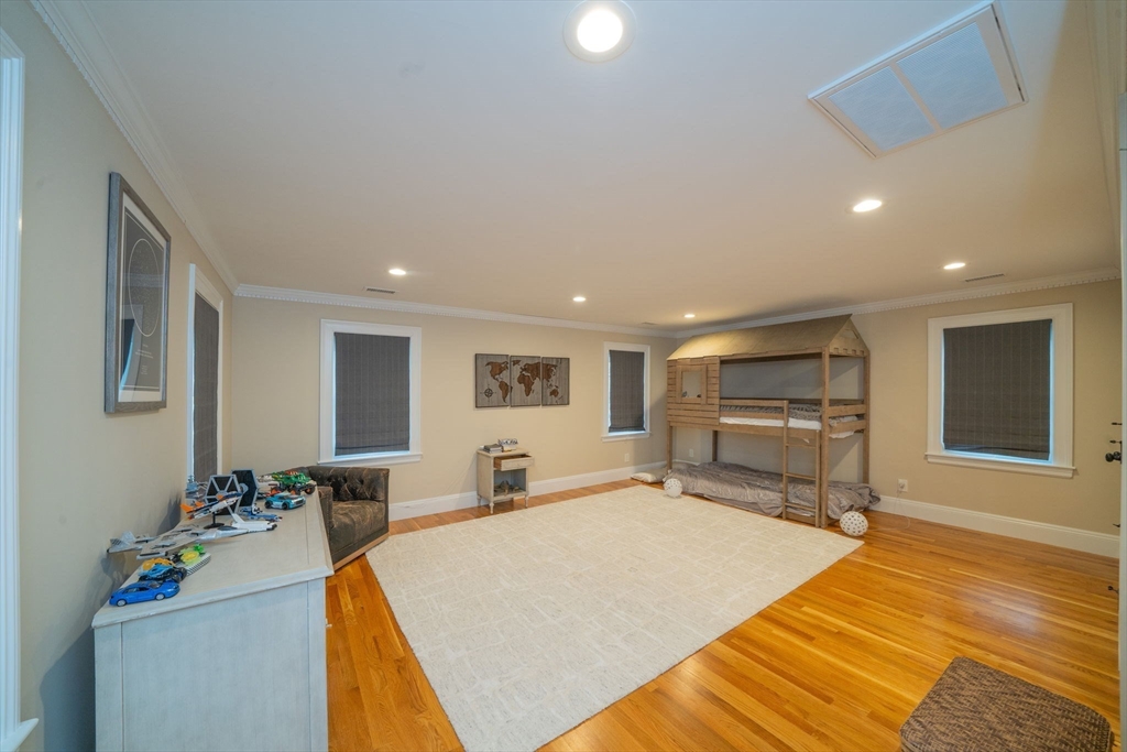 642 Centre Street Newton, MA 02458 - Photo 27 of 37 a bed room with a bed and a television