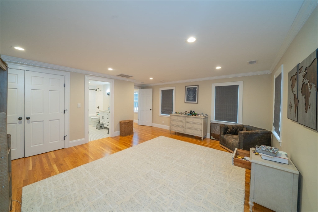 642 Centre Street Newton, MA 02458 - Photo 29 of 37 a bed room with a bed and a television