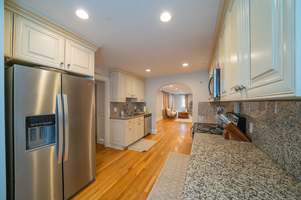 642 Centre Street Newton, MA 02458 - Photo 3 of 37 a kitchen with stainless steel appliances granite countertop a refrigerator and a sink