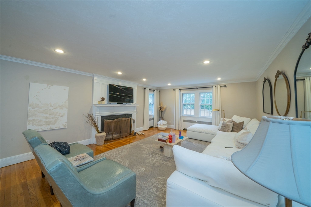 642 Centre Street Newton, MA 02458 - Photo 4 of 37 a living room with furniture and a fireplace