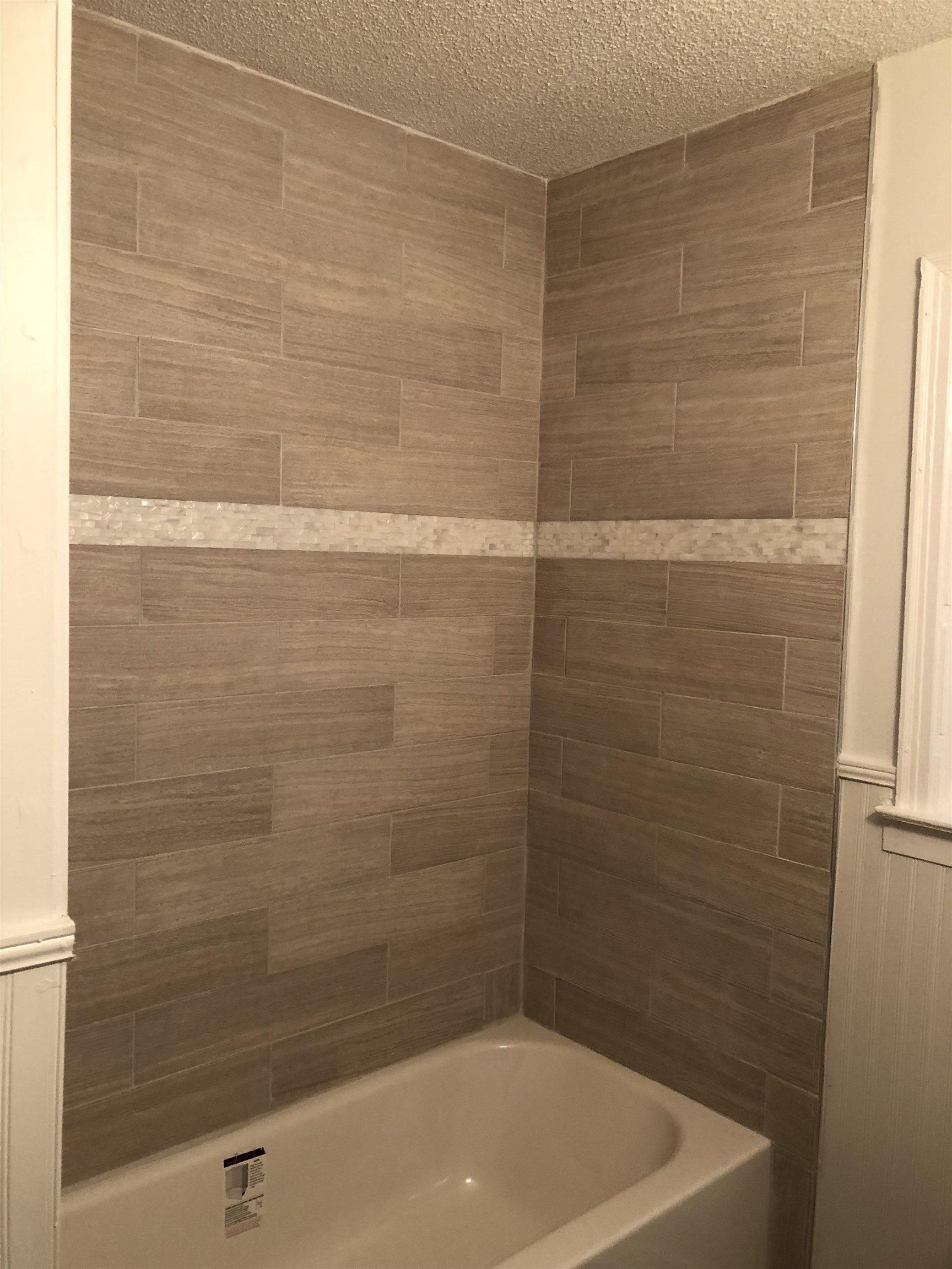 3628 Carrington Road Memphis, TN 38111 - Photo 5 of 11 Bathroom featuring tiled shower / bath combo and a textured ceiling