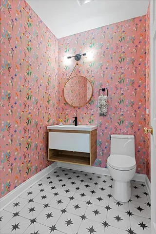 a bathroom with a toilet and a sink