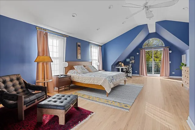 a spacious bedroom with a bed and a window