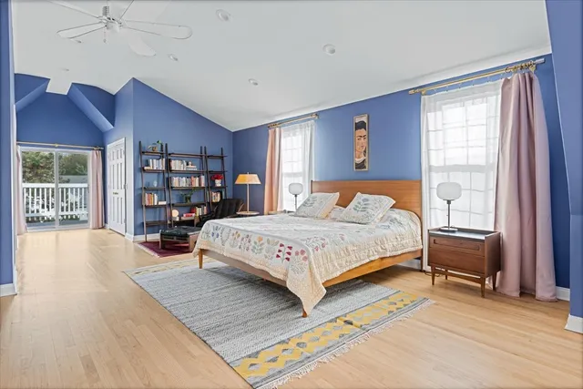 a bedroom with a large bed and a window