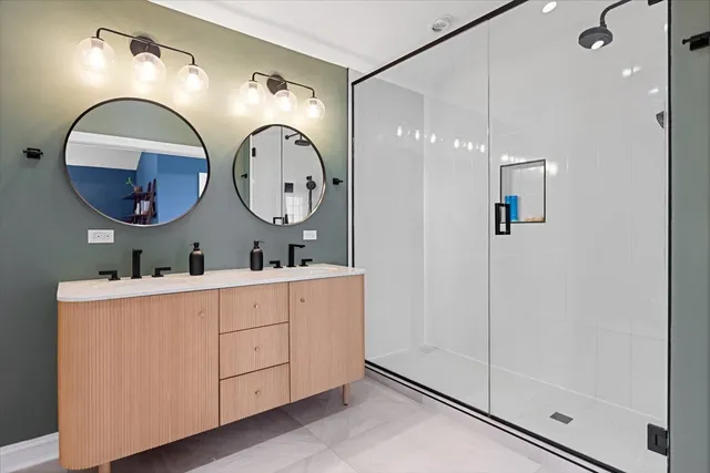 a bathroom with a mirror and a sink