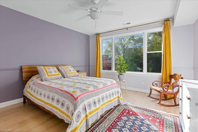 a bedroom with a bed and glass window