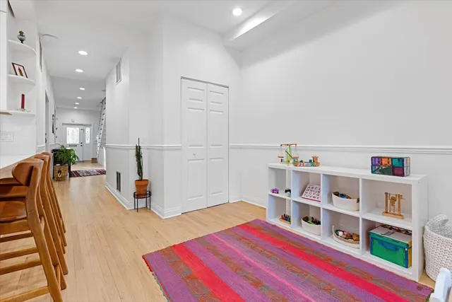 a bedroom with furniture and a book shelf