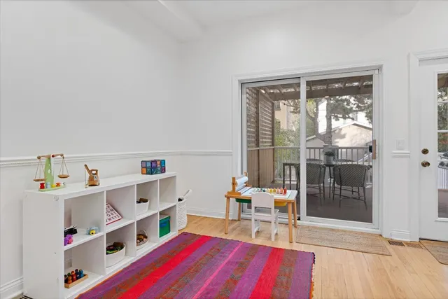 a very nice looking room with a large window and a dining table
