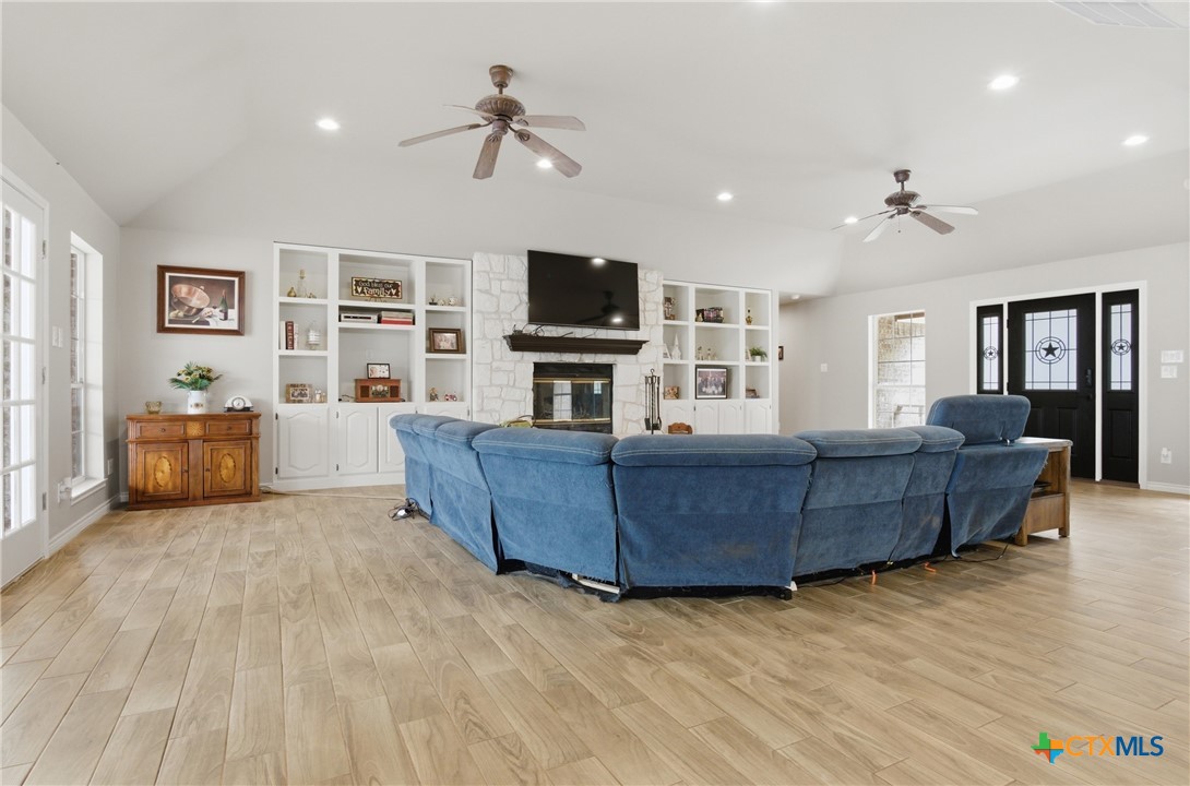 642 Phantom Rider Trail Spring Branch, TX 78070 - Photo 10 of 41 a living room with furniture and a flat screen tv