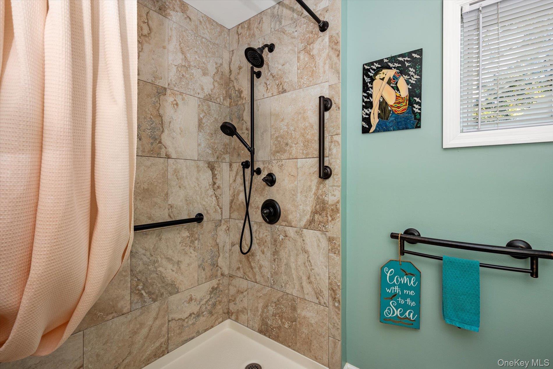 65 Harriet Road North Babylon, NY 11703 - Photo 12 of 31 Full bathroom featuring a tile shower