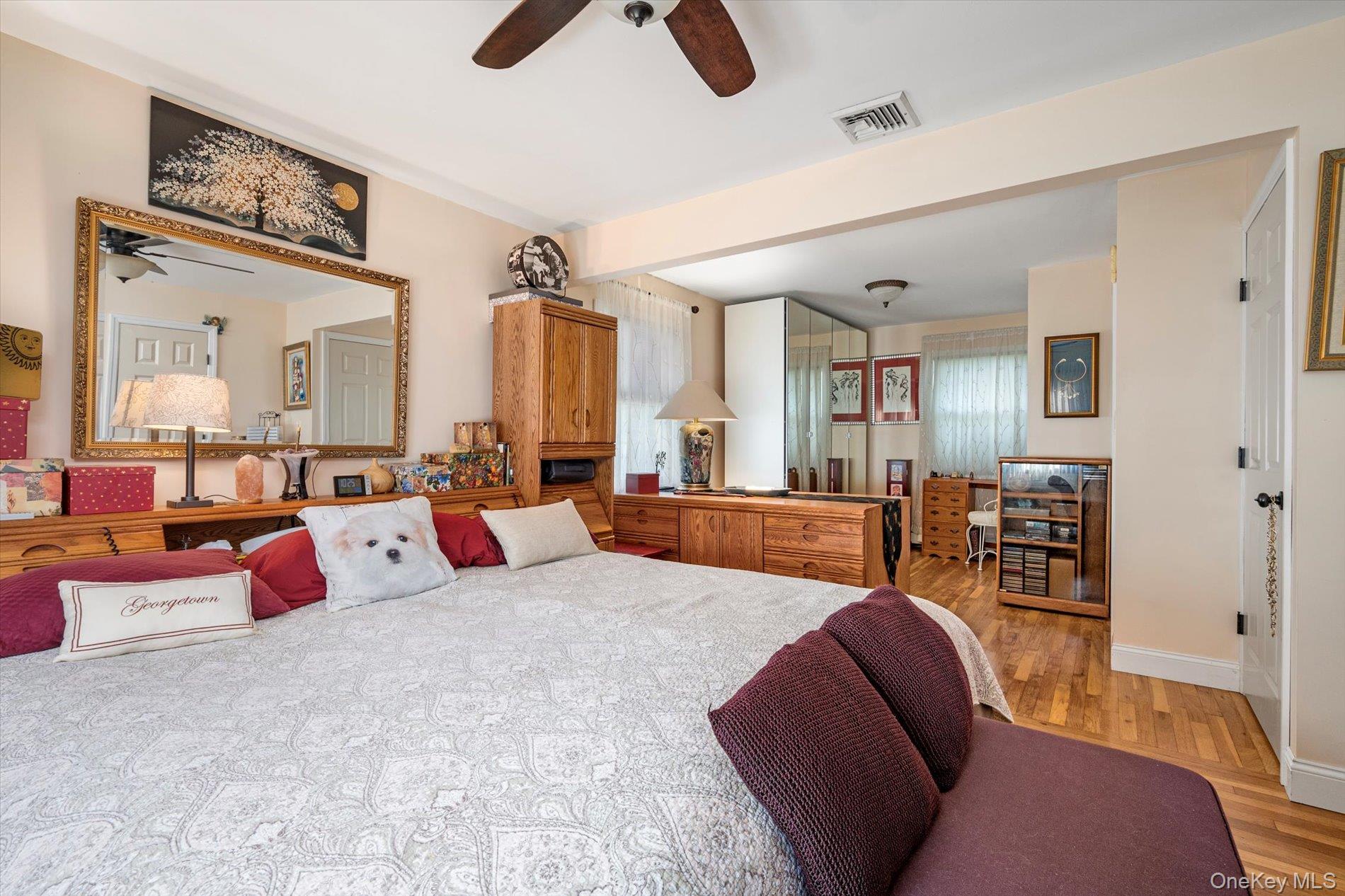 65 Harriet Road North Babylon, NY 11703 - Photo 15 of 31 Bedroom featuring light wood-style flooring and a ceiling fan