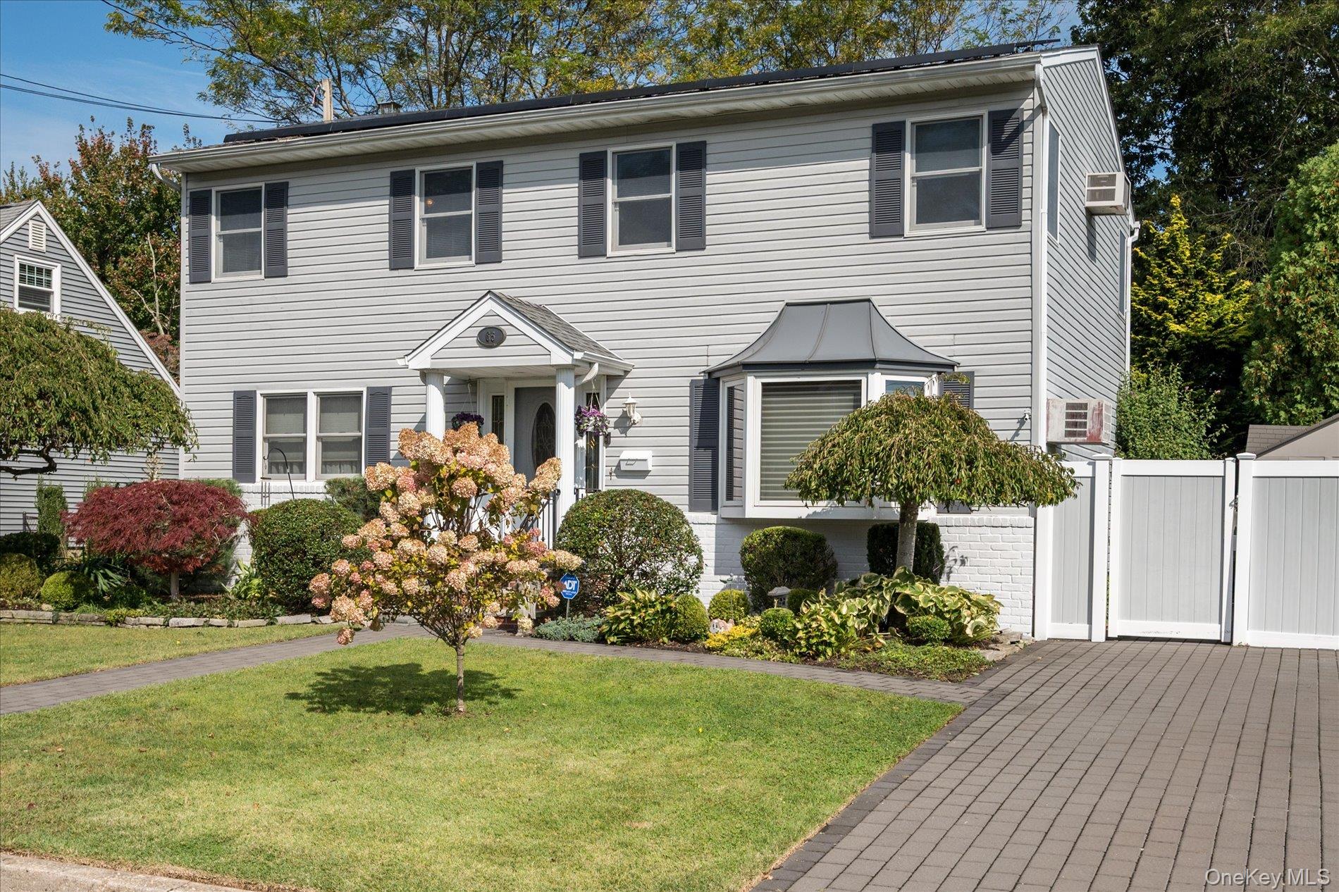 65 Harriet Road North Babylon, NY 11703 - Photo 2 of 31 View of front facade featuring a gate
