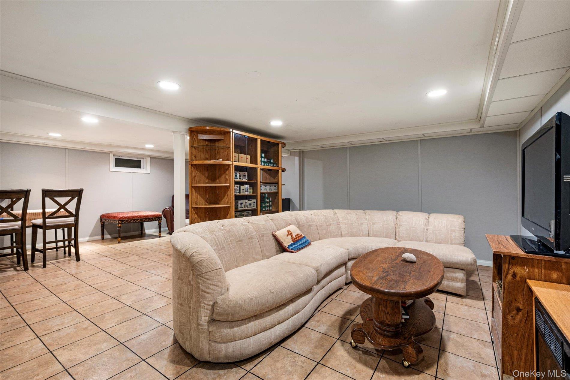 65 Harriet Road North Babylon, NY 11703 - Photo 22 of 31 Living room featuring recessed lighting and light tile patterned flooring