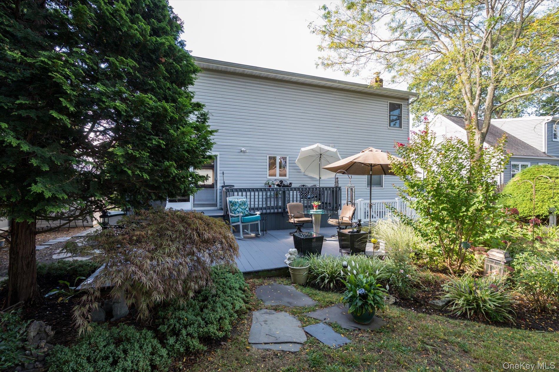 65 Harriet Road North Babylon, NY 11703 - Photo 25 of 31 Back of property featuring a wooden deck