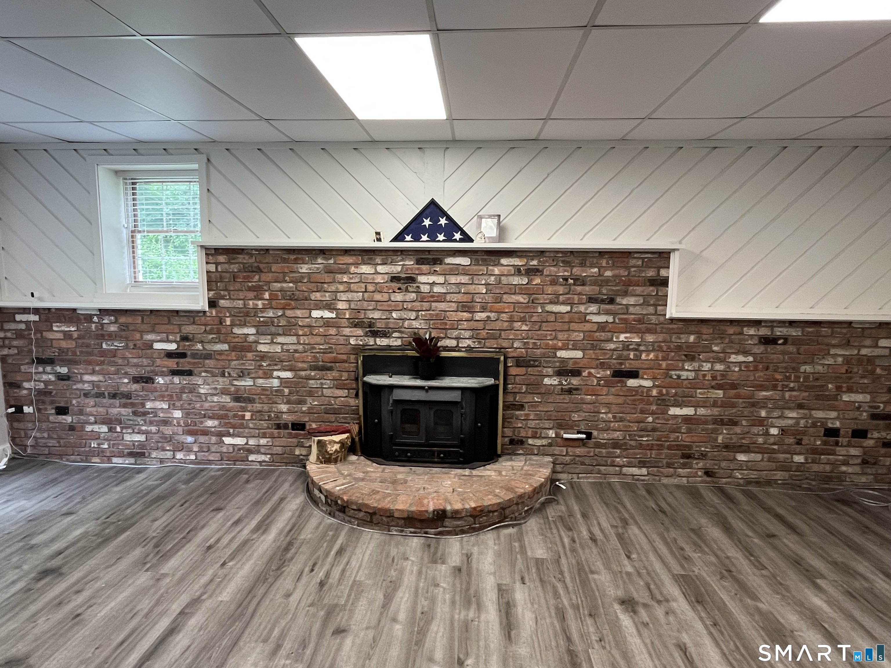 47 Merwin Brook Road Brookfield, CT 06804 - Photo 20 of 29 Wood burning Fireplace welcomes you to the lower level family room.