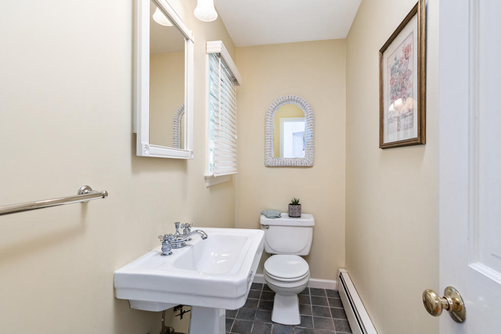 78 Stanton Road Darien, CT 06820 - Photo 17 of 33 a bathroom with a toilet sink and mirror