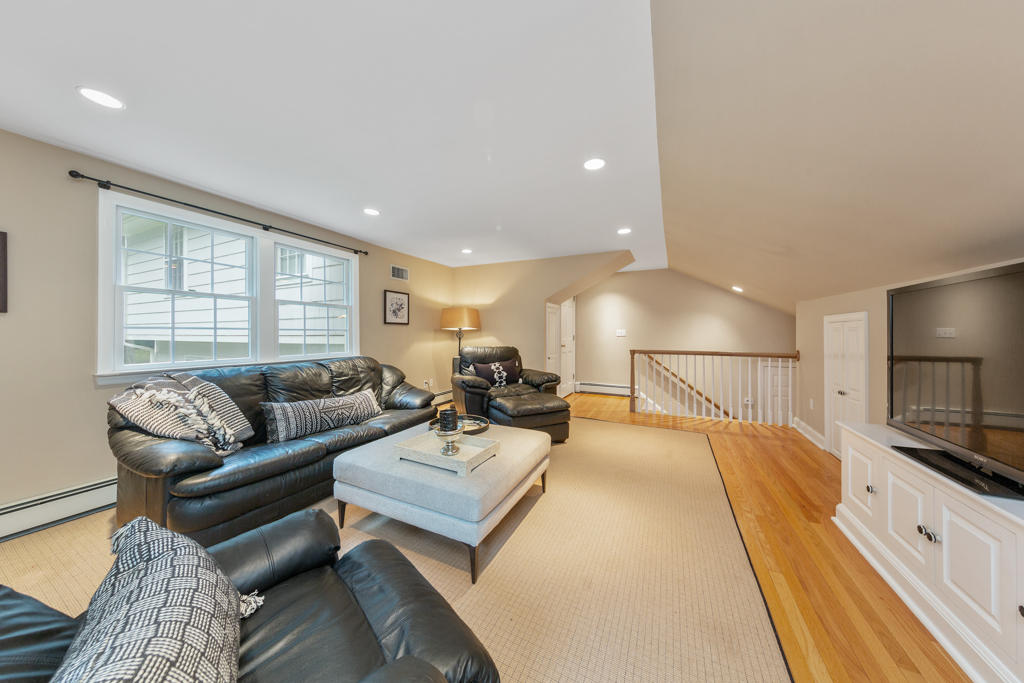 78 Stanton Road Darien, CT 06820 - Photo 18 of 33 a living room with furniture and a flat screen tv